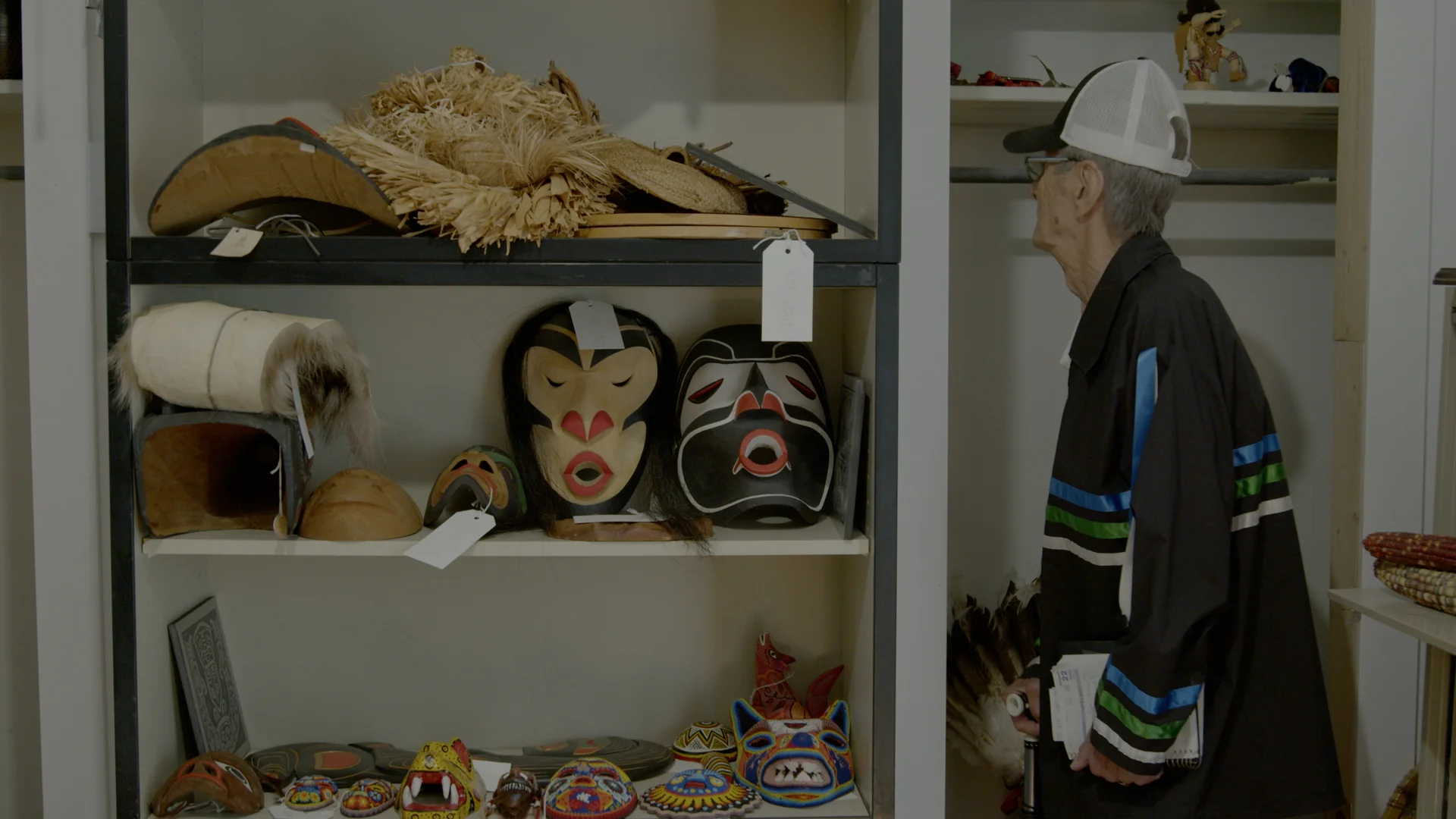 Carved masks displayed in the collections gallery